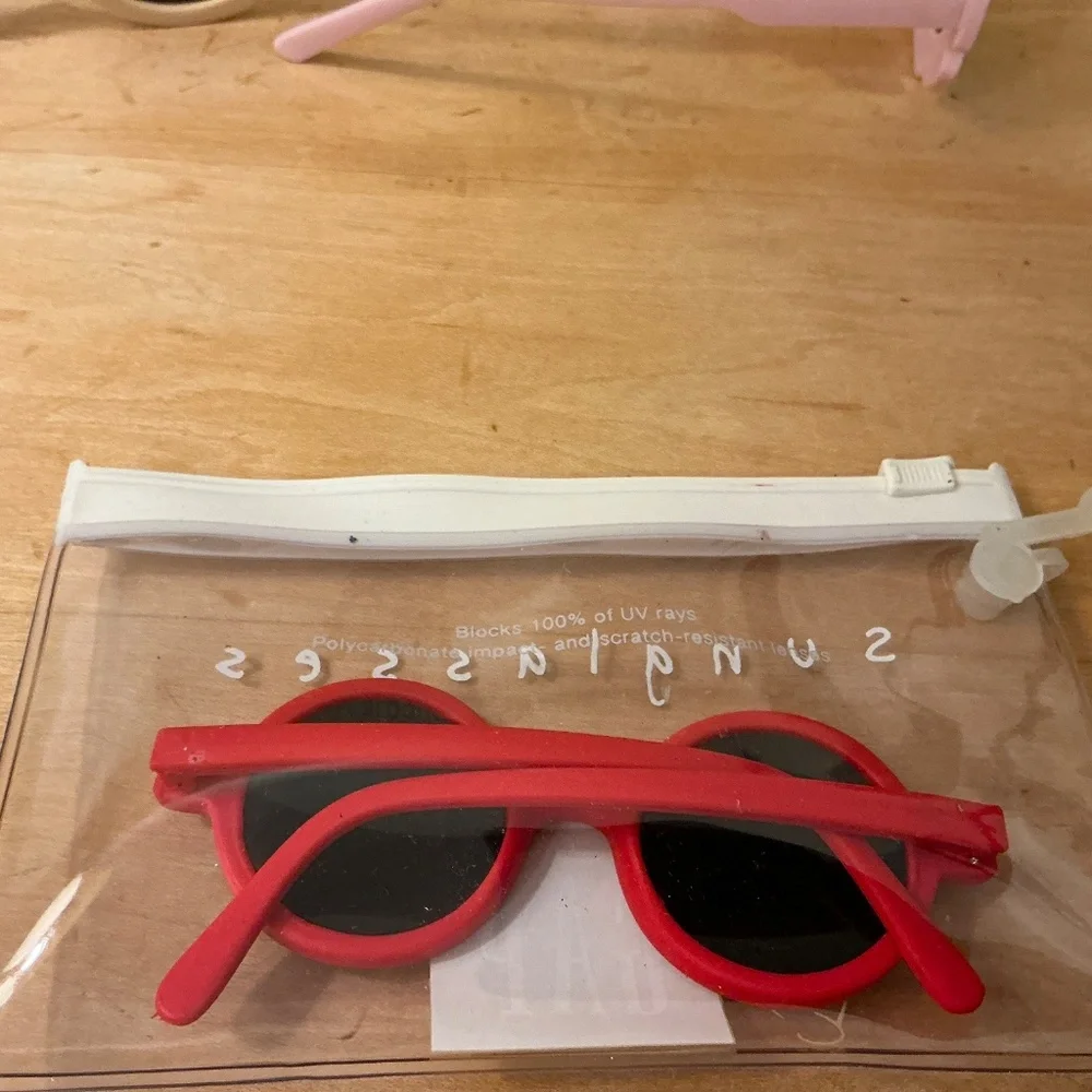 Collection of sunglasses (Baby Gap and others)and swim goggles Stephen Joseph